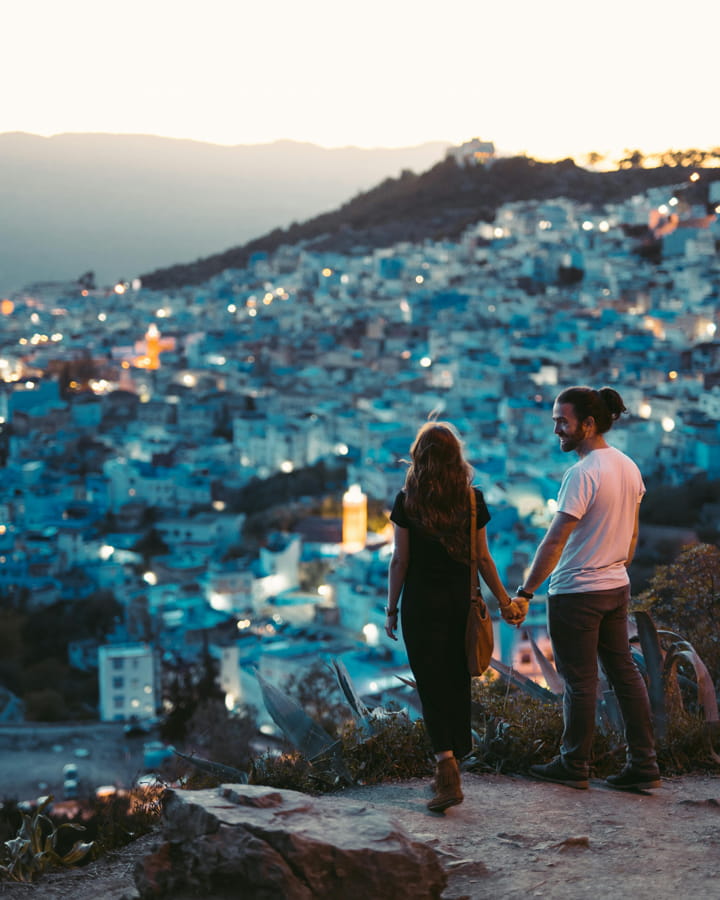 a couple looking at the view of a city