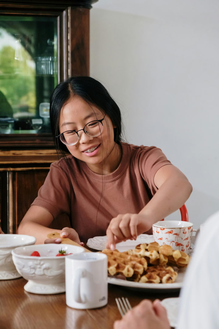 a girl eating breakfast