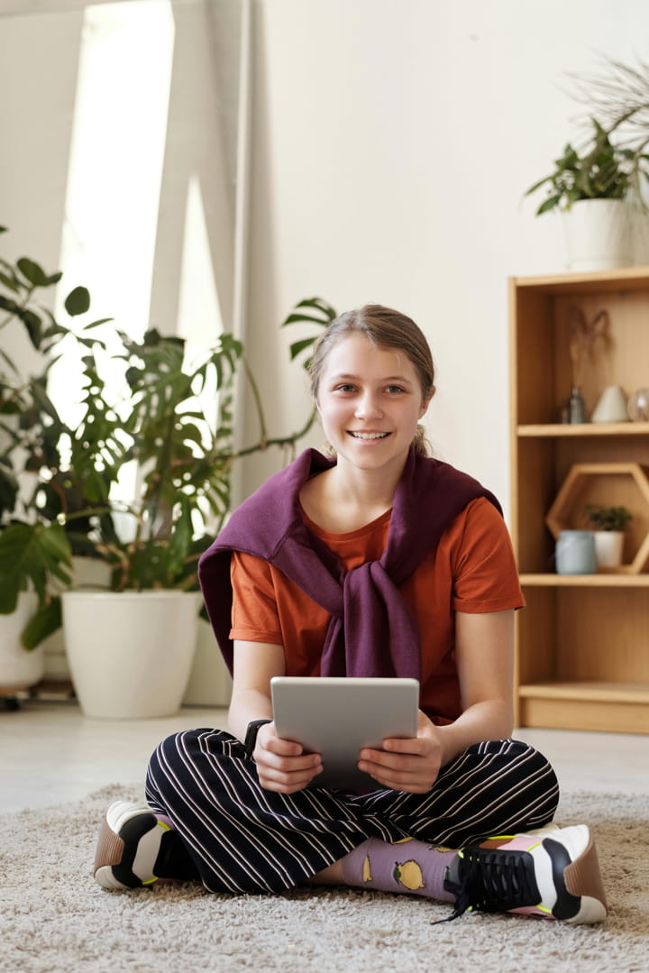 A teen on her tablet