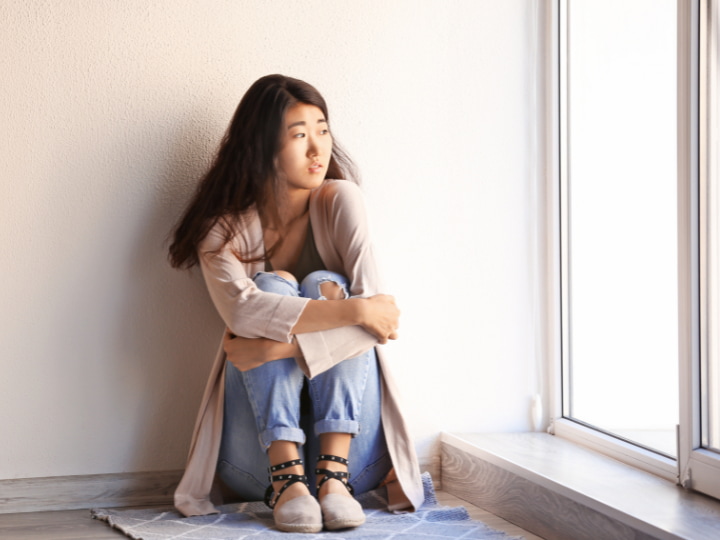 a girl looking out her window